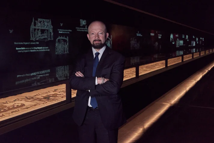 Meet the curious billionaire who began life as a refugee, and brought the Bayeux Tapestry to Britain